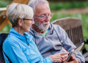 Older couple looking at an ipad 